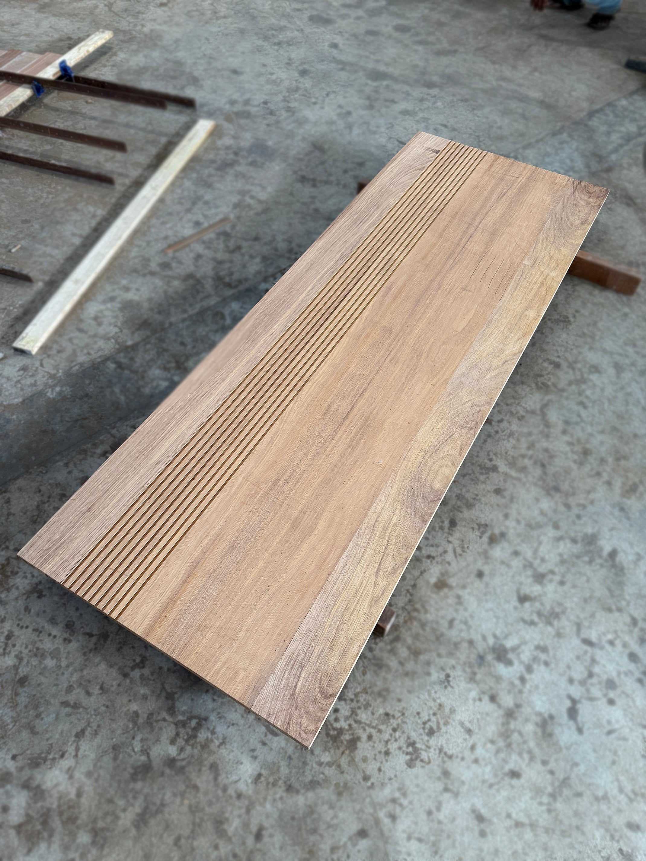 Grade A wooden door made out of full solid merbau hardwood with customised groove lines design.
