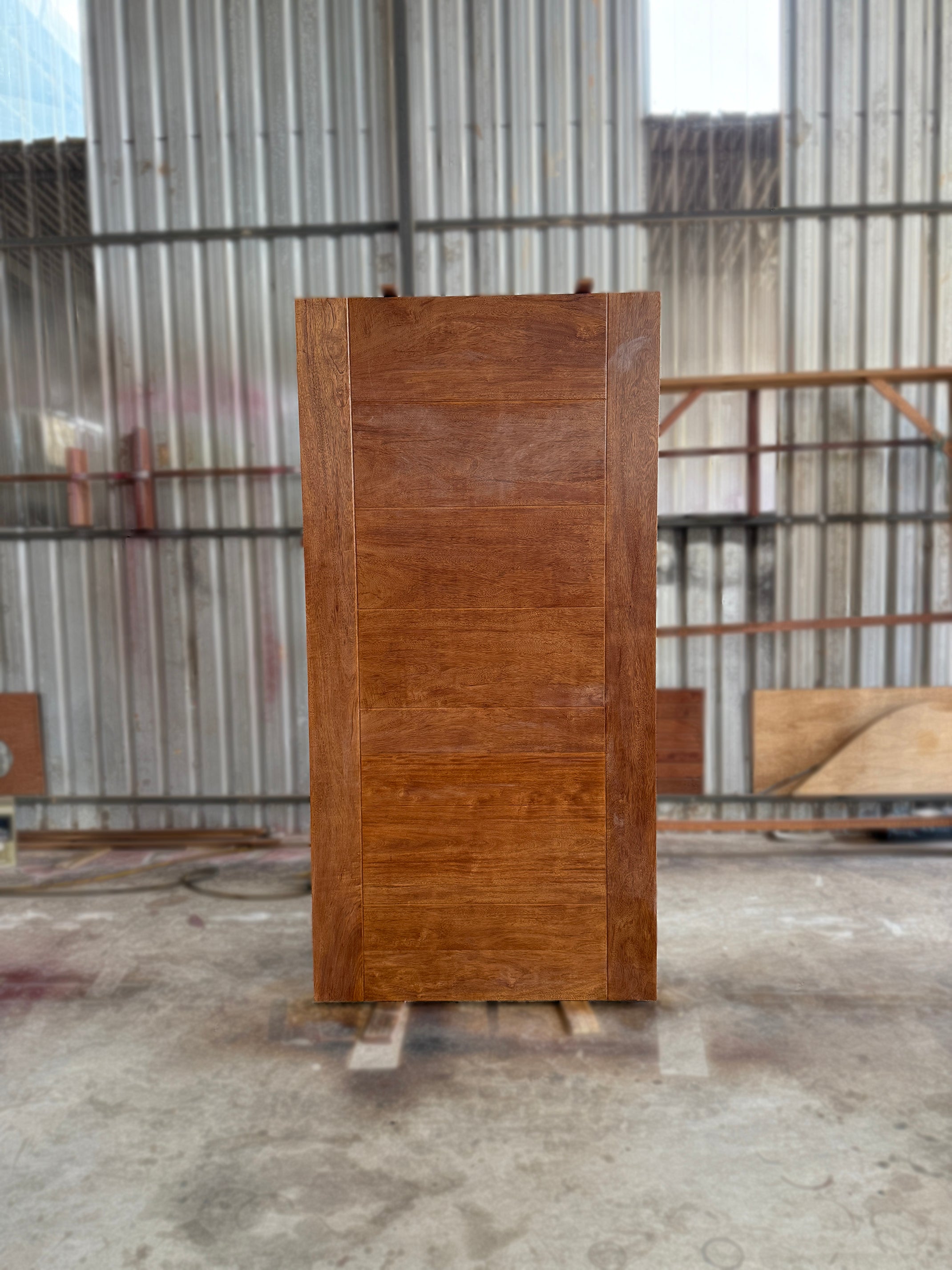 Grade A wooden door made from full solid merbau hardwood after clear lacquer finishing.