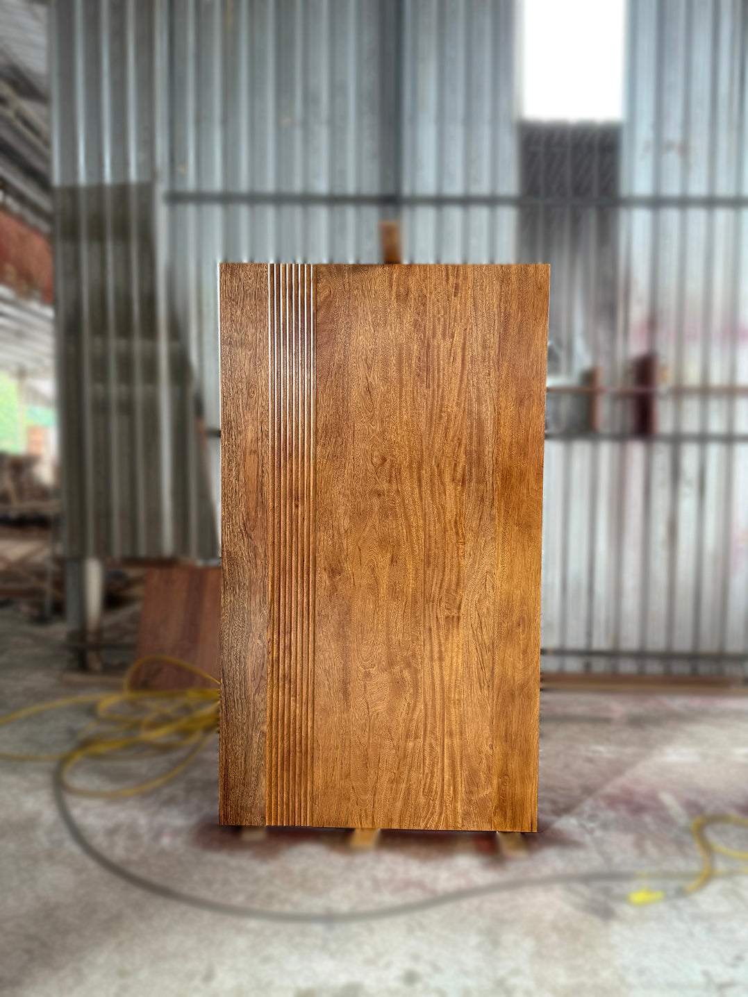 Large Grade A full solid timber door made out of merbau hardwood with modern wave design and clear lacquer finished.
