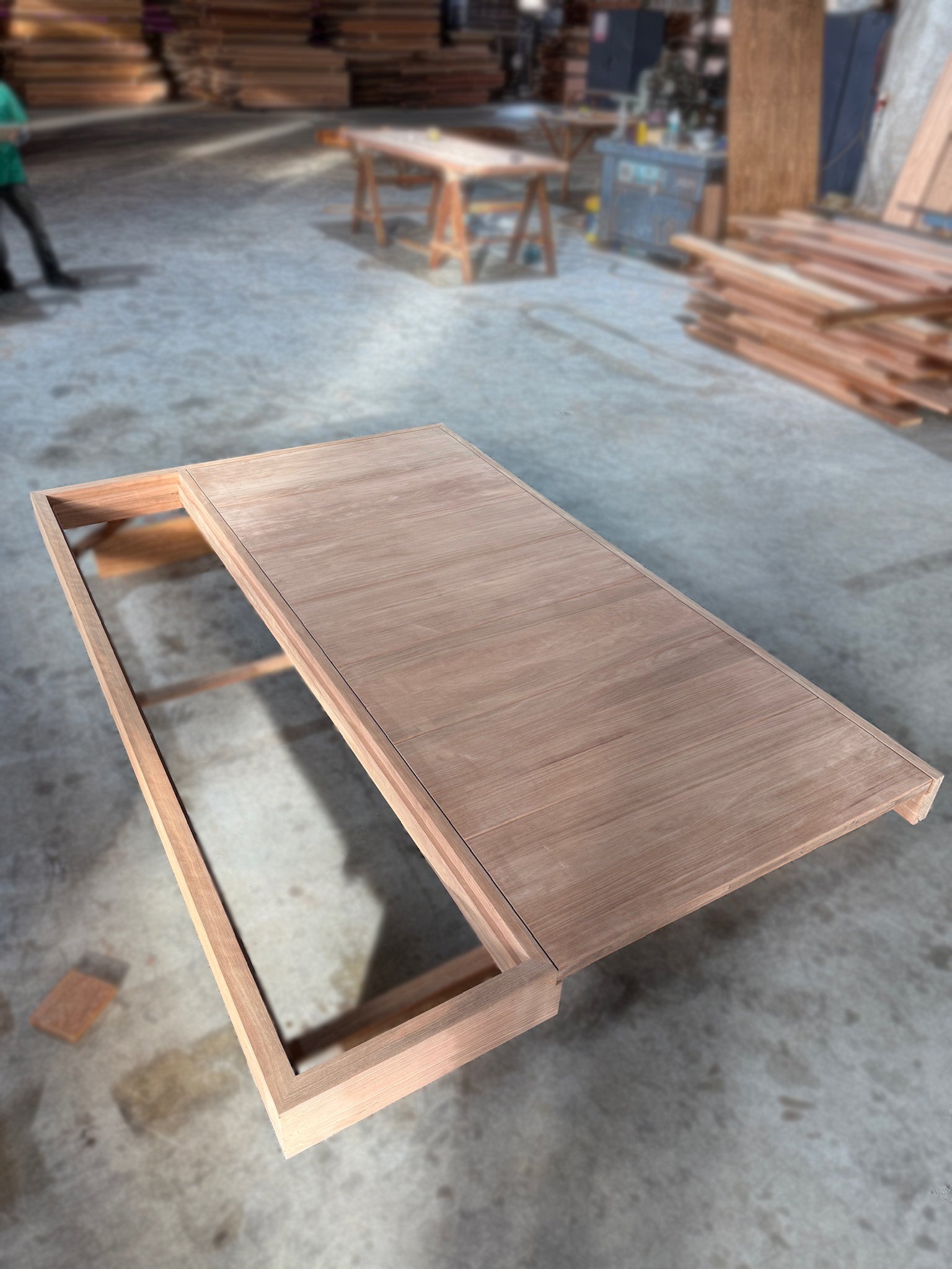 A set of customised door frame and door made out of full solid nyatoh hardwood putting together after sanding.