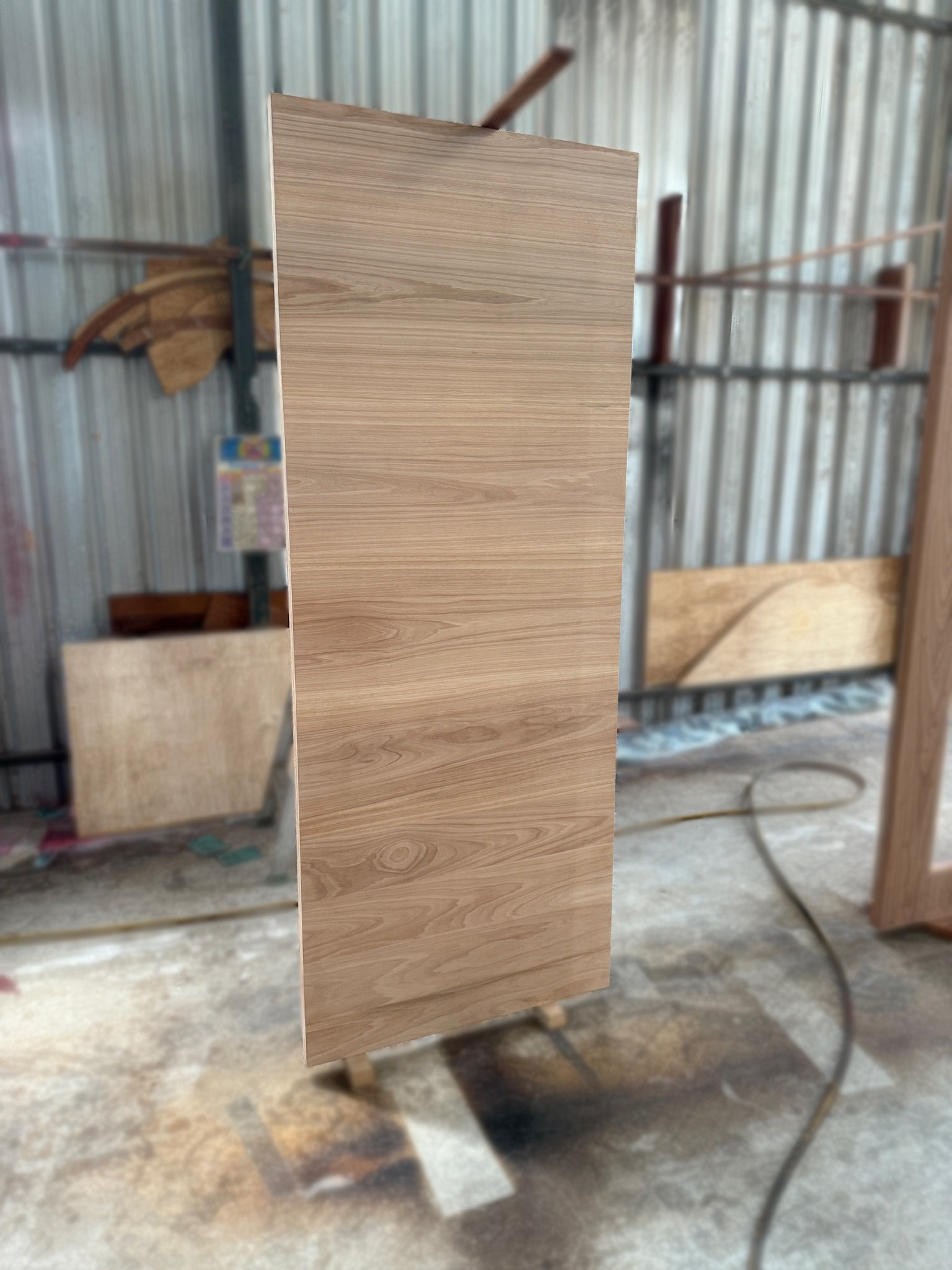Grade A full solid nyatoh hardwood door with horizontal panel design after smooth sanding process.
