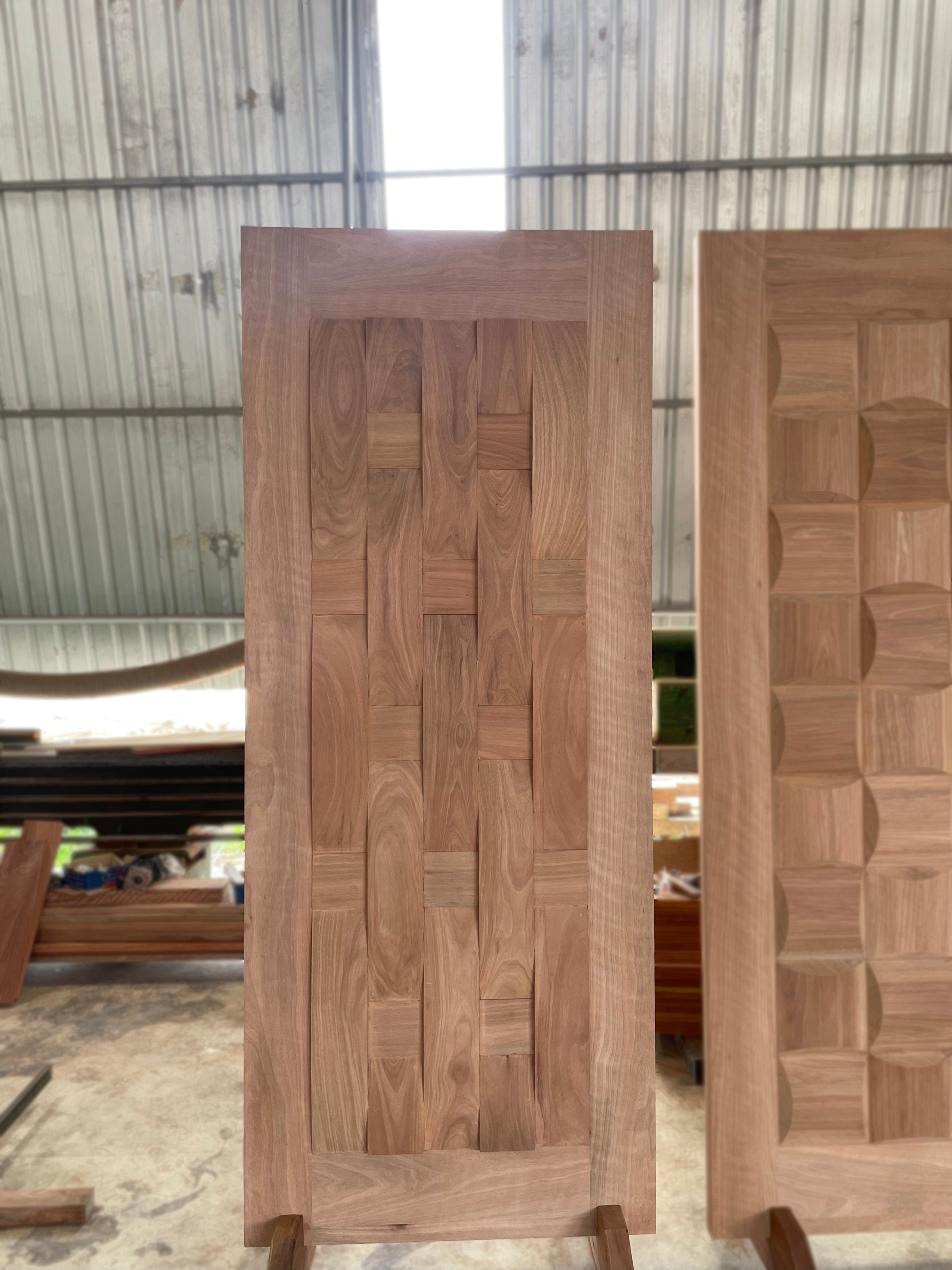 Full solid hardwood door made out of nyatoh wood, with a unique geometrical design.